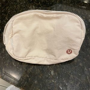 Tan/off white Lululemon belt bag